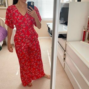 Francesca’s red floral jumpsuit